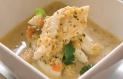 Whiting fillets poached in a coconut milk, basil and tomato broth