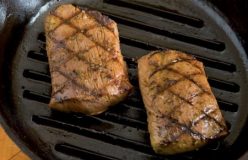 Marinated lamb with tomato, cucumber and fetta salad with spiced nuts