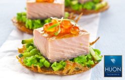 Huon hot smoked salmon on rosti with crushed peas, zucchini and salmon roe.